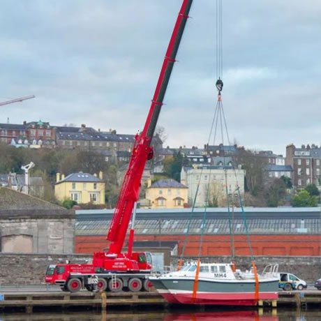 Crane lifting a boat